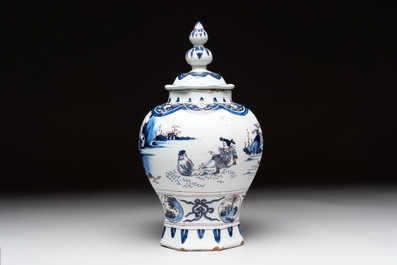 A blue, white and manganese Dutch Delft chinoiserie vase and cover, ca. 1700