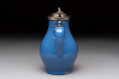 A very rare blue-glazed Dutch Delft jug with a mounted silver cover, 18th C.