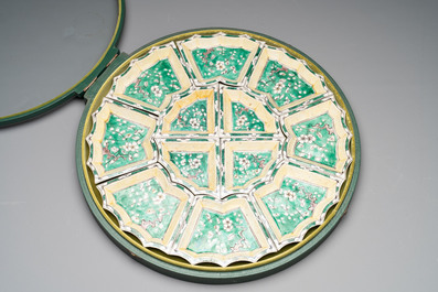A Chinese verte biscuit 12-piece 'plum blossoms' sweetmeat set in a case, Kangxi