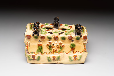 A polychrome-glazed inkwell with relief design, possibly Italy or France, 18/19th C.
