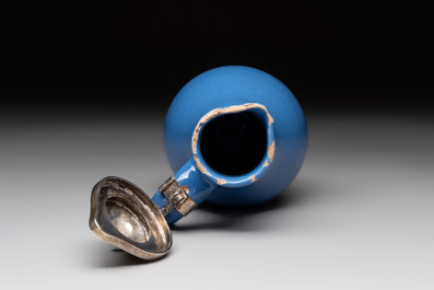 A very rare blue-glazed Dutch Delft jug with a mounted silver cover, 18th C.