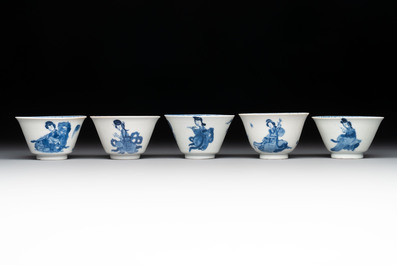 Five Chinese blue and white 'elegant beauty and boy' cups and saucers, Chenghua mark, Kangxi