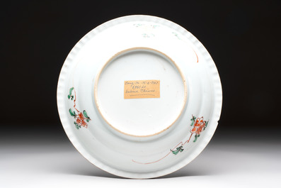 A Chinese famille verte 'elegant beauties in a garden' plate, Kangxi