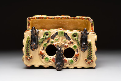 A polychrome-glazed inkwell with relief design, possibly Italy or France, 18/19th C.