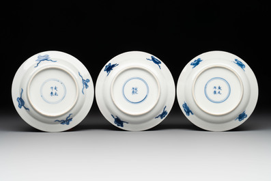 Five Chinese blue and white 'elegant beauty and boy' cups and saucers, Chenghua mark, Kangxi