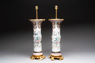 A pair of Chinese famille rose vases with fine gilt-bronze lamp mounts, Yongzheng