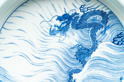 A rare large imperial Chinese blue and white 'dragon and carps' basin, Kangxi mark and of the period