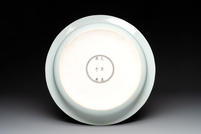 A rare large imperial Chinese blue and white 'dragon and carps' basin, Kangxi mark and of the period