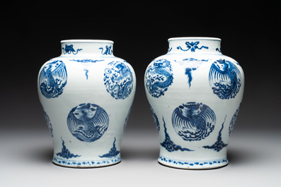 A pair of Chinese blue and white 'dragons and phoenixes' vases, Kangxi