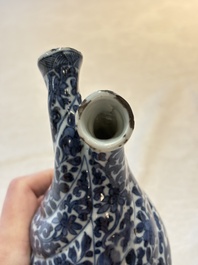 A Chinese blue and white double-spouted swirling-lobed cruet, Kangxi