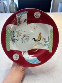 A pair of Chinese famille rose ruby-ground 'scrolls and rooster' plates, Yongzheng
