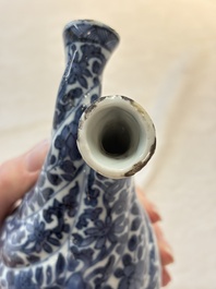 A Chinese blue and white double-spouted swirling-lobed cruet, Kangxi