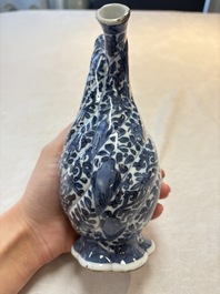 A Chinese blue and white double-spouted swirling-lobed cruet, Kangxi