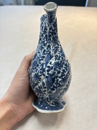 A Chinese blue and white double-spouted swirling-lobed cruet, Kangxi
