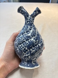 A Chinese blue and white double-spouted swirling-lobed cruet, Kangxi