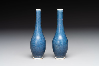 A pair of Chinese blue-glazed 'Hatcher Cargo' bottle vases with incised dragons, Transitional period