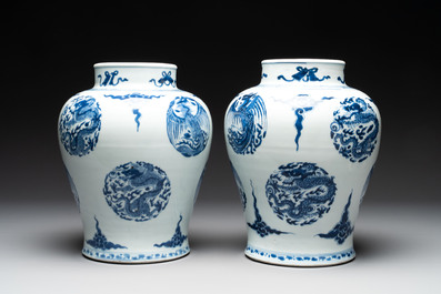 A pair of Chinese blue and white 'dragons and phoenixes' vases, Kangxi