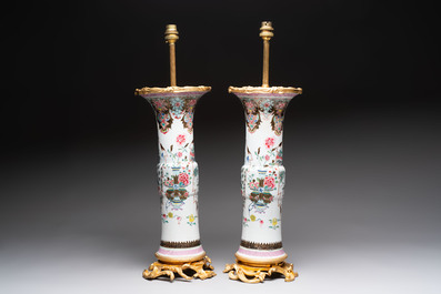 A pair of Chinese famille rose vases with fine gilt-bronze lamp mounts, Yongzheng