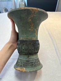 A Chinese archaic bronze wine vessel with taotie design, 'zun 尊', Western Zhou