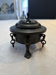 A Chinese bronze tripod censer and cover, Sui/Tang
