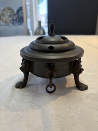 A Chinese bronze tripod censer and cover, Sui/Tang