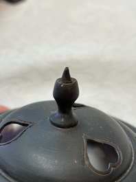 A Chinese bronze tripod censer and cover, Sui/Tang
