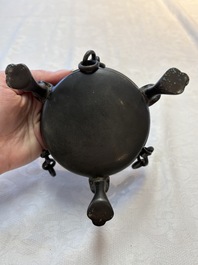 A Chinese bronze tripod censer and cover, Sui/Tang