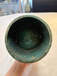 A Chinese archaic bronze wine vessel with taotie design, 'zun 尊', Western Zhou