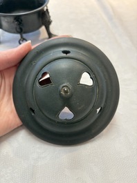 A Chinese bronze tripod censer and cover, Sui/Tang
