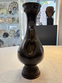 A large Chinese bronze 'hu' vase with luduan-form handles, Yuan