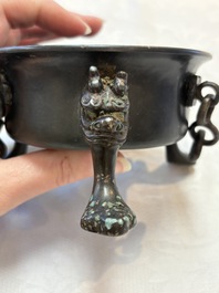 A Chinese bronze tripod censer and cover, Sui/Tang