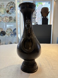 A large Chinese bronze 'hu' vase with luduan-form handles, Yuan