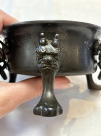 A Chinese bronze tripod censer and cover, Sui/Tang