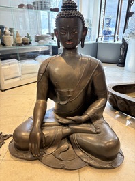An exceptionally large Nepalese bronze figure of Buddha, 19th C.
