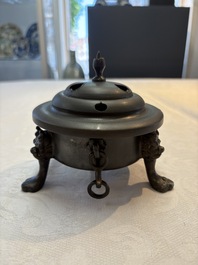 A Chinese bronze tripod censer and cover, Sui/Tang