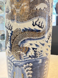 A large Chinese gilt-decorated blue and white 'dragon' rouleau vase, 19th C.