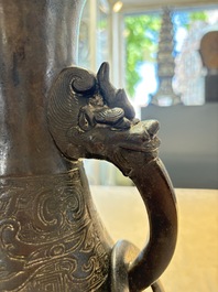 A large Chinese bronze 'hu' vase with luduan-form handles, Yuan
