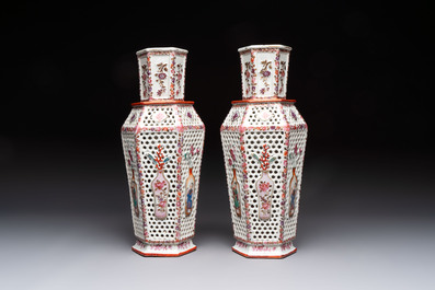A pair of Chinese famille rose reticulated double-walled 'mandarin subject' vases, Qianlong