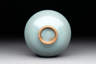 A small Chinese blue-glazed 'jun' tea cup with a wooden box, Song/Yuan