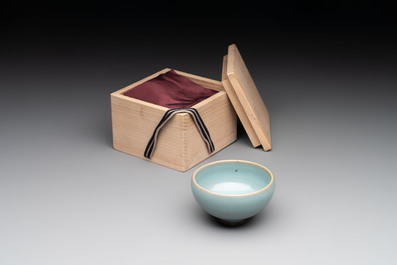A small Chinese blue-glazed 'jun' tea cup with a wooden box, Song/Yuan