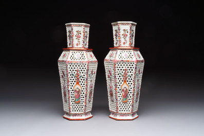 A pair of Chinese famille rose reticulated double-walled 'mandarin subject' vases, Qianlong
