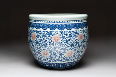 A fine Chinese blue, white and copper-red 'lotus scroll' fish bowl, Qianlong