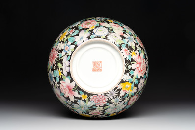 A Chinese famille rose 'millefleurs' water container, a covered bowl, a spoon and a famille noire vase mounted as lamp, Qianlong mark, 19/20th C.