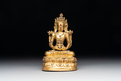 A Sino-Tibetan coral and turquoise-inlaid gilt-bronze Buddha Amitayus, 18th C.