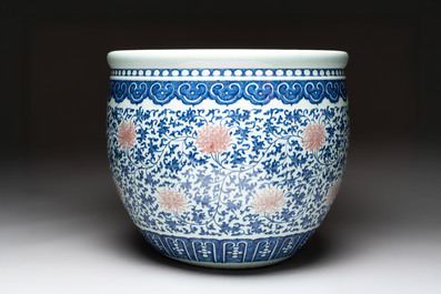 A fine Chinese blue, white and copper-red 'lotus scroll' fish bowl, Qianlong