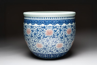 A fine Chinese blue, white and copper-red 'lotus scroll' fish bowl, Qianlong