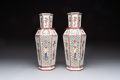 A pair of Chinese famille rose reticulated double-walled 'mandarin subject' vases, Qianlong