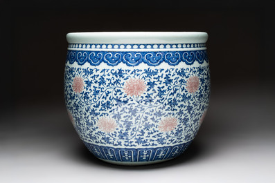 A fine Chinese blue, white and copper-red 'lotus scroll' fish bowl, Qianlong