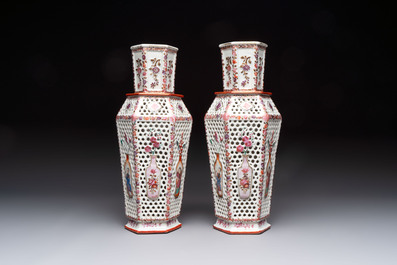 A pair of Chinese famille rose reticulated double-walled 'mandarin subject' vases, Qianlong