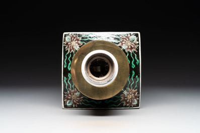 A Chinese famille rose 'millefleurs' water container, a covered bowl, a spoon and a famille noire vase mounted as lamp, Qianlong mark, 19/20th C.